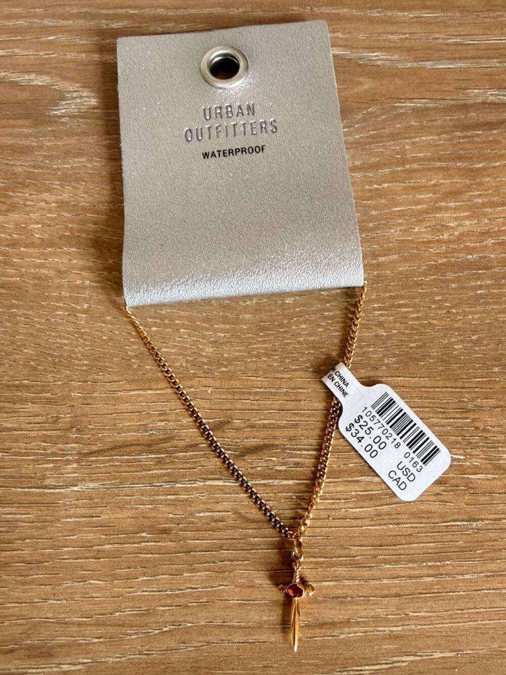 NWT Urban Outfitters Gold & Red Gem Dagger Waterproof Bracelet